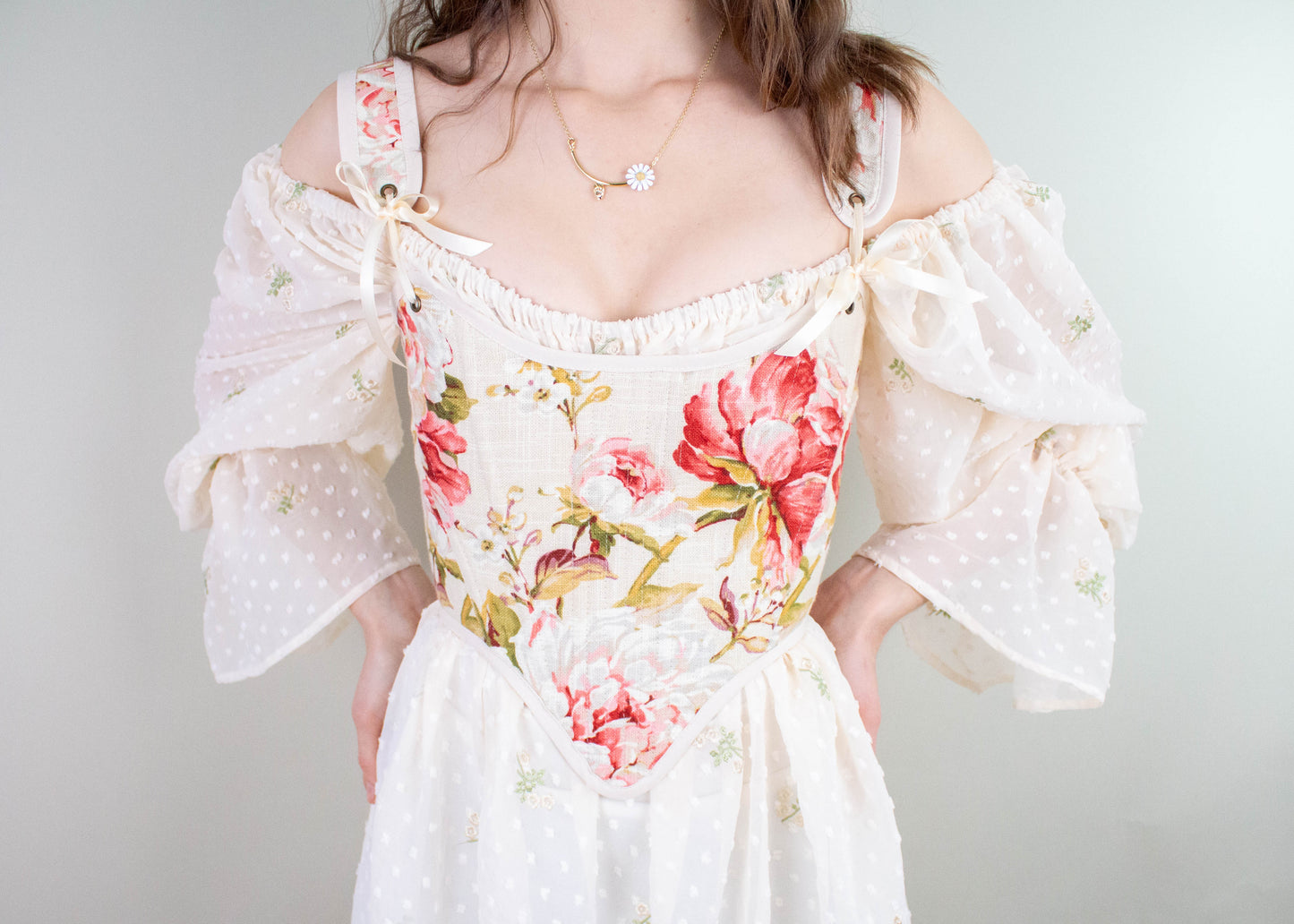 Handmade Covington Tea Rose Corset with pink floral pattern and sheer off-shoulder puff sleeves in cottagecore style