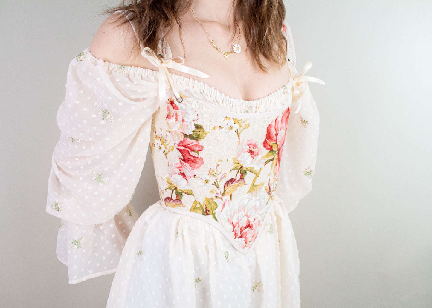 Handmade Covington Tea Rose Corset with pink floral bodice and sheer off-shoulder puff sleeves in cottagecore style