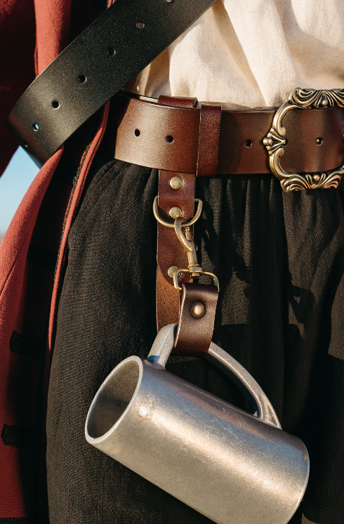 Heavy Duty Leather Tankard Strap attached to belt holding metal tankard with decorative belt buckle background