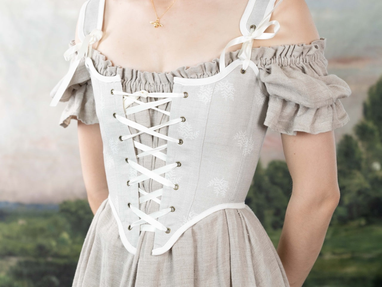 Woman wearing a Handmade Beige Fern Corset with delicate lacing and subtle fern embroidery over linen fabric