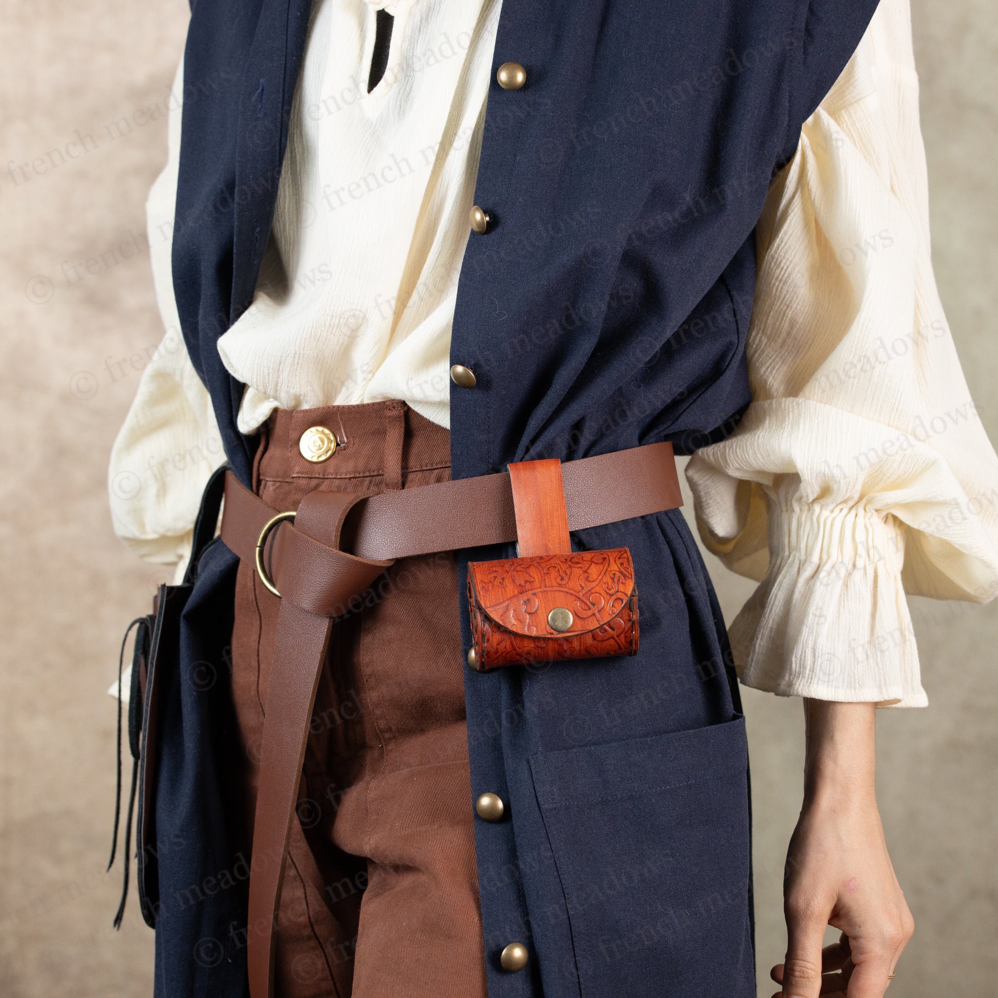 model wearing spyglass pouch on a brown vegan leather belt