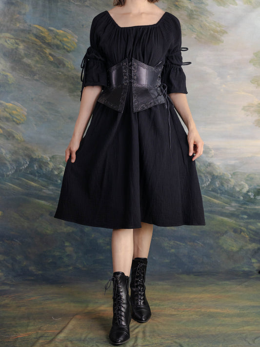 Black Cotton Puff Sleeve Chemise worn with corset and lace-up boots against painted backdrop