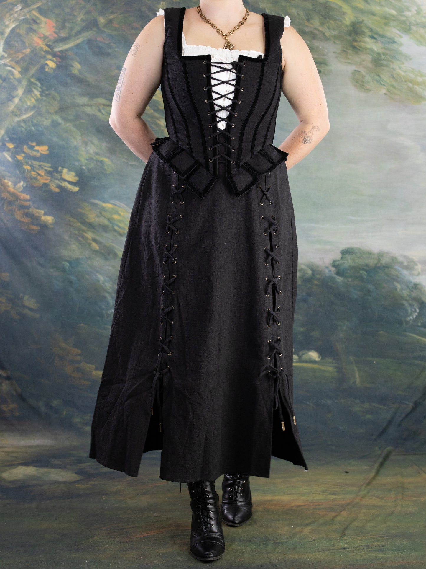 Black Pirate Doublet shown in portrait with front lacing and structured bodice over a long black skirt with lace-up sides