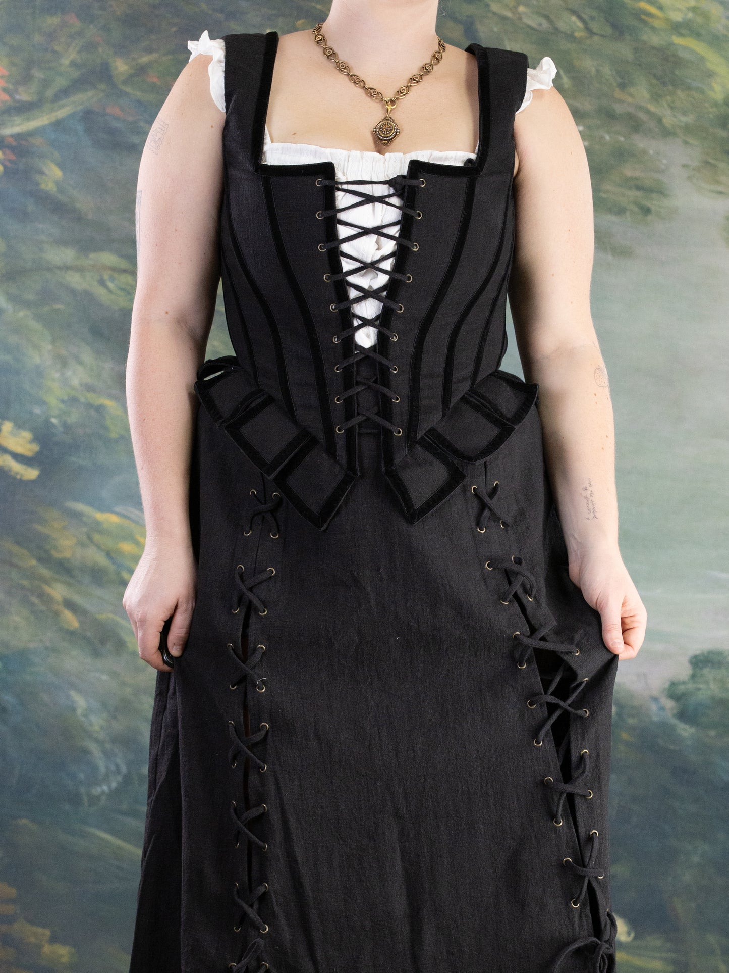 Front view of Black Pirate Doublet with lace-up bodice and decorative peplum in portrait orientation