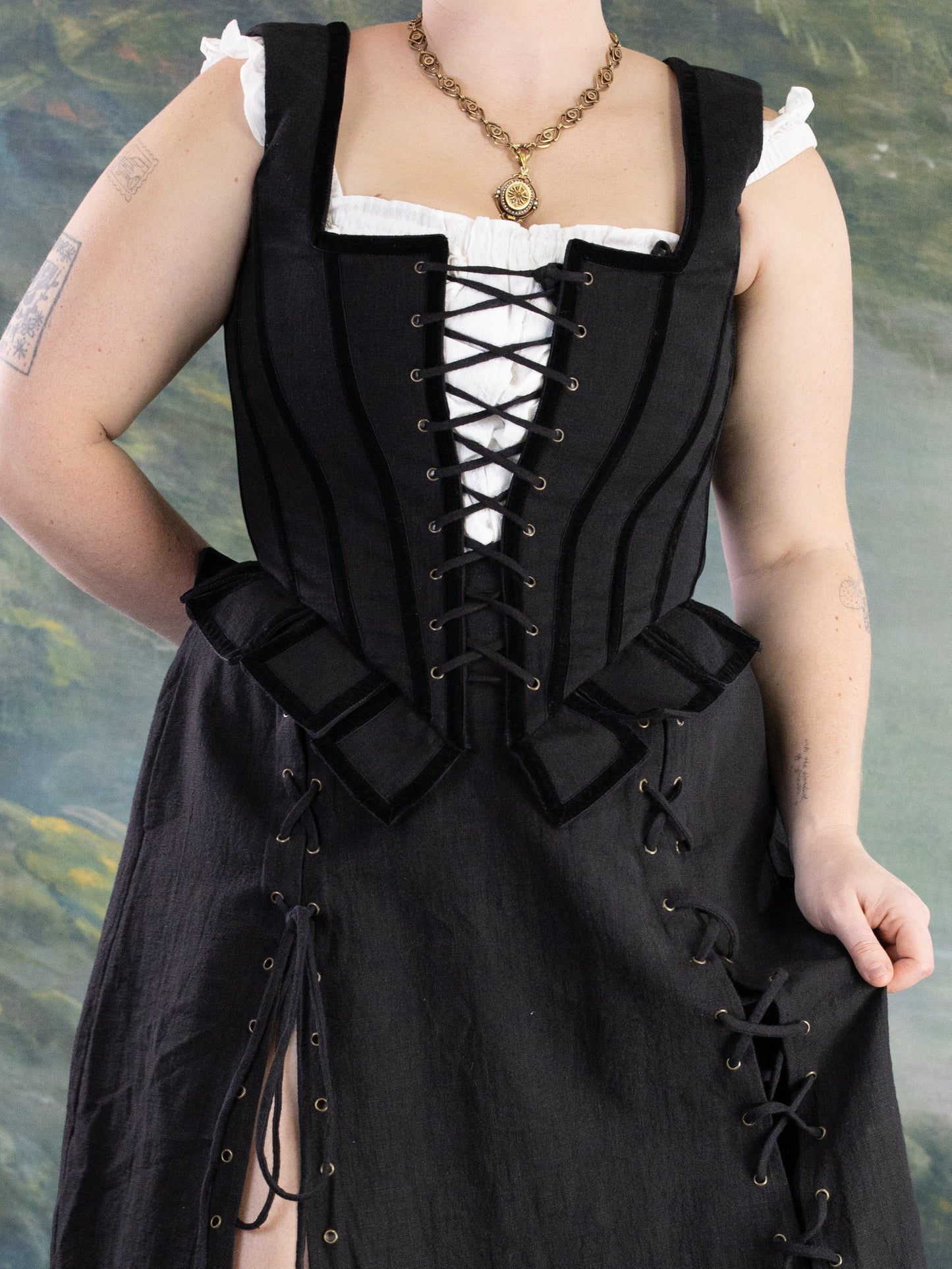 Black Pirate Doublet front view on model showing lace-up corset style and peplum detail in portrait orientation