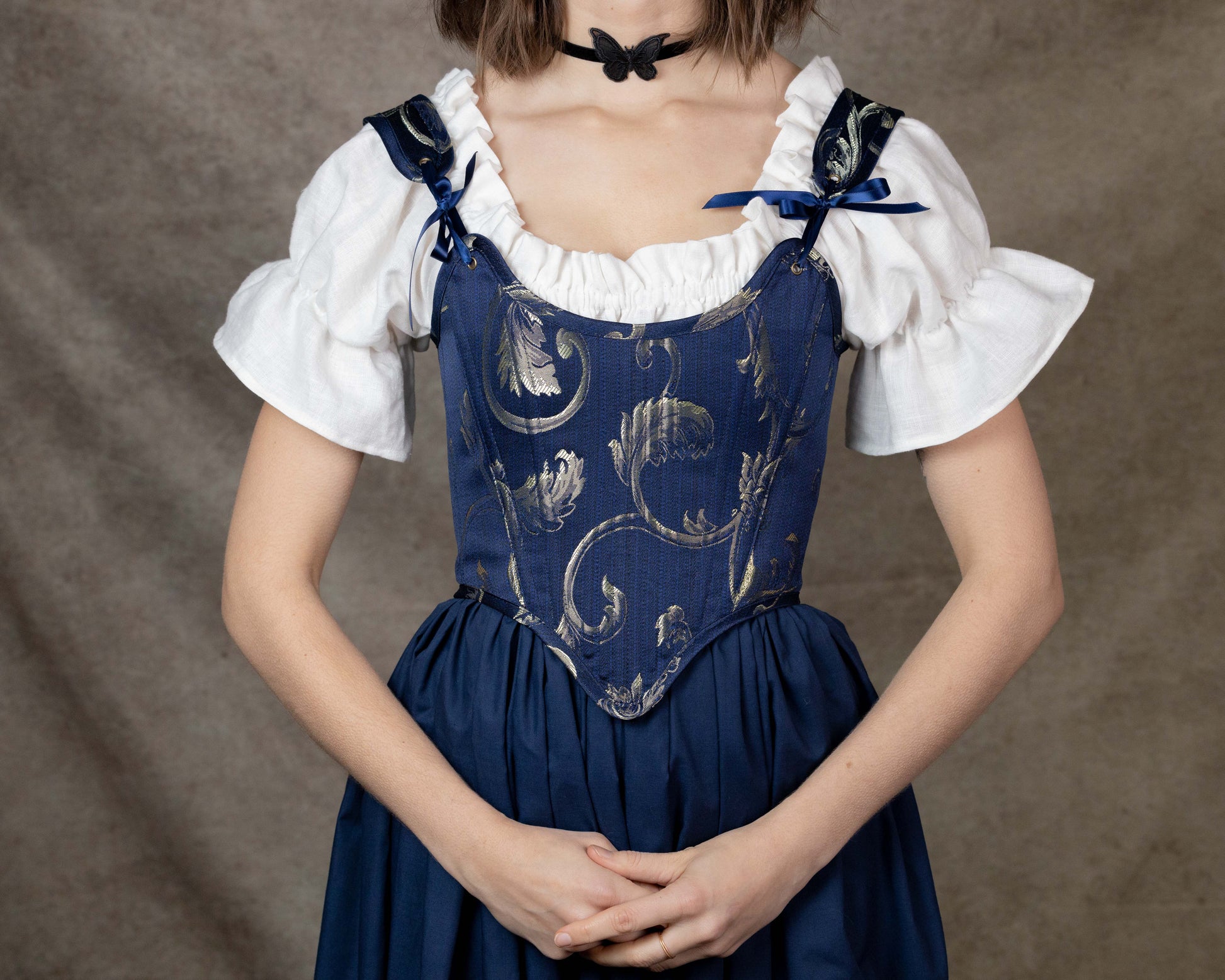 Handmade Blue and Gold Jacquard Stays with floral bodice, adjustable straps, and navy skirt in princess and knight aesthetic