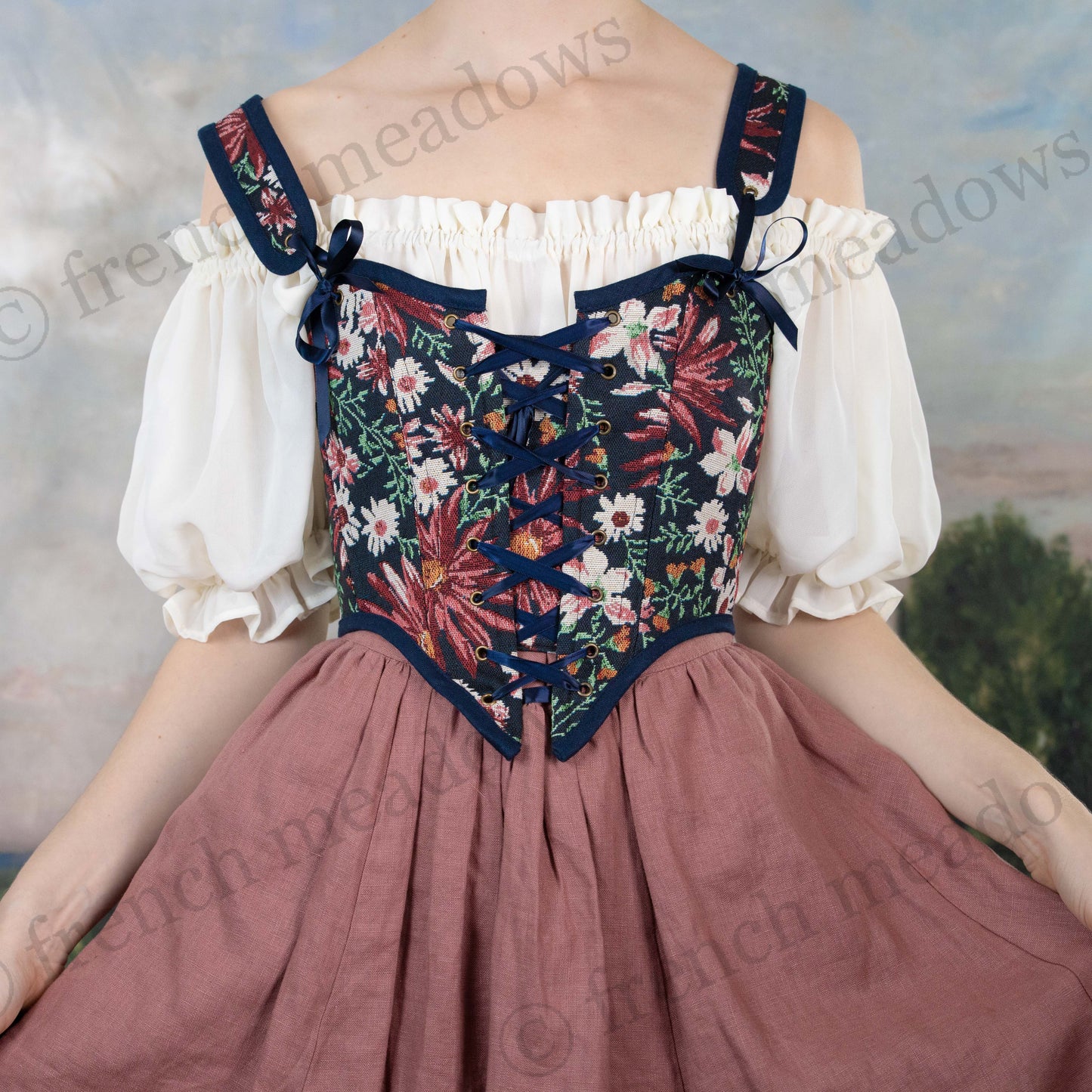 model wearing blue floral corset with pink linen skirt and sheer chiffon chemise dress