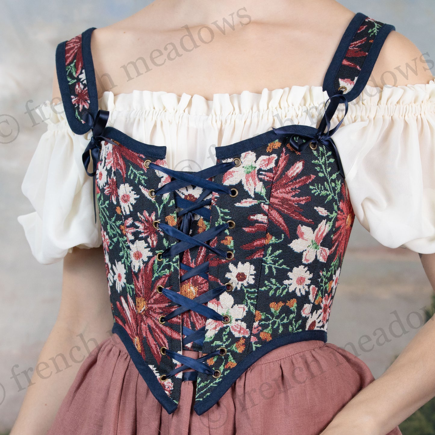 close up view of navy blue floral tapestry corset top