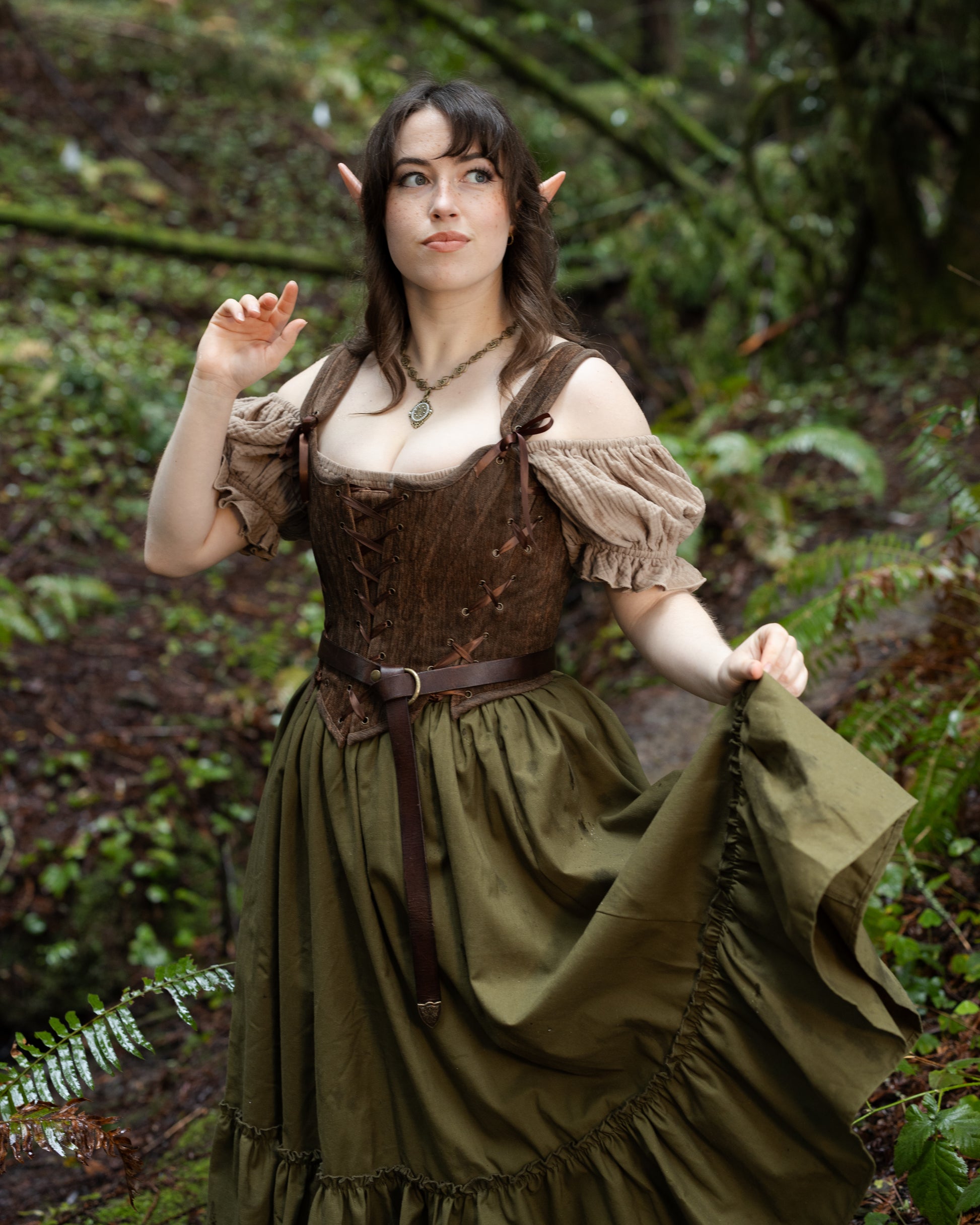 Woman modeling Brown Princess Stays corset in a forest, gallery position 5, portrait orientation, 4000x5000px image