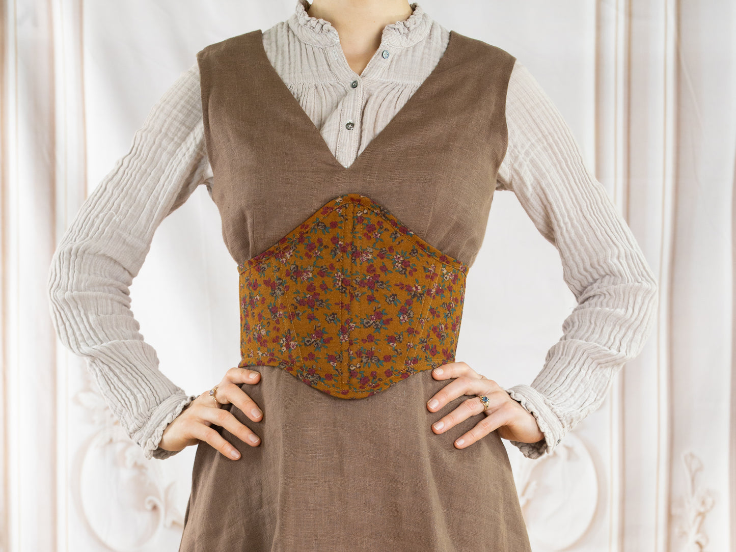 Woman wearing brown corset belt with floral pattern over beige dress Corset Belt PDF Sewing Pattern