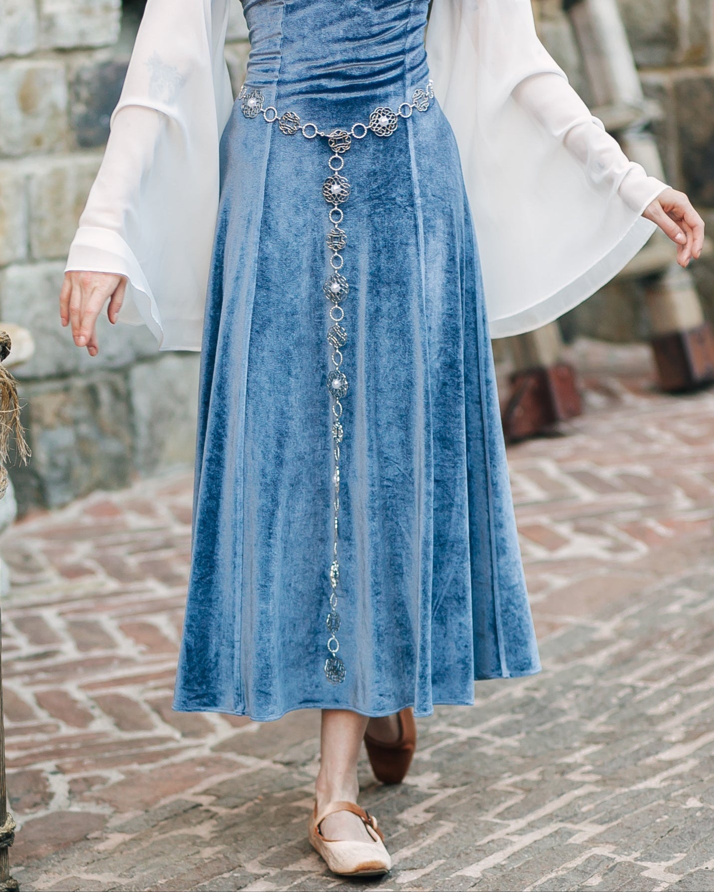 Rosette Medieval Chain Belt worn over a blue velvet dress with filigree rosette medallion details and Tudor style inspiration