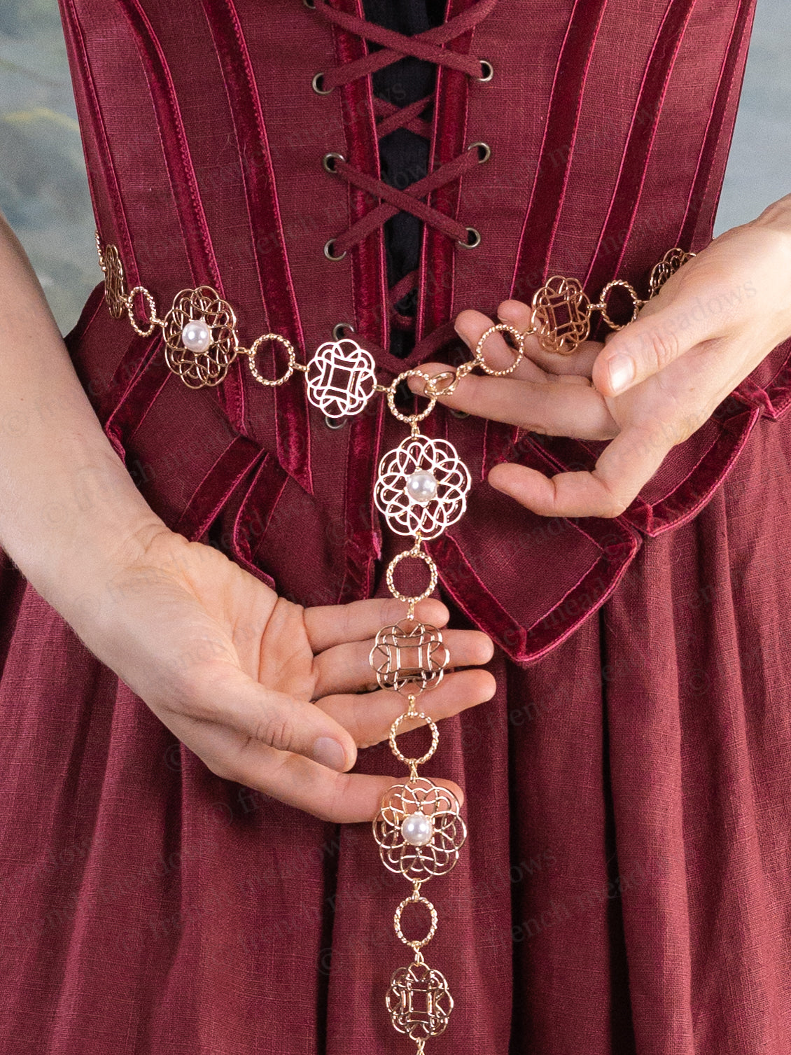 Rosette Medieval Chain Belt with filigree rosette medallions and pearl accents worn over a burgundy medieval dress