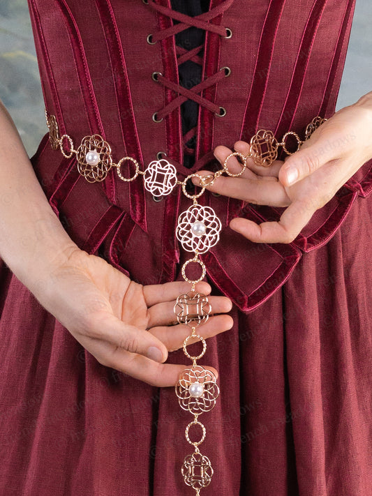 Rosette Medieval Chain Belt with filigree rosette medallions and pearl accents worn over a burgundy medieval dress