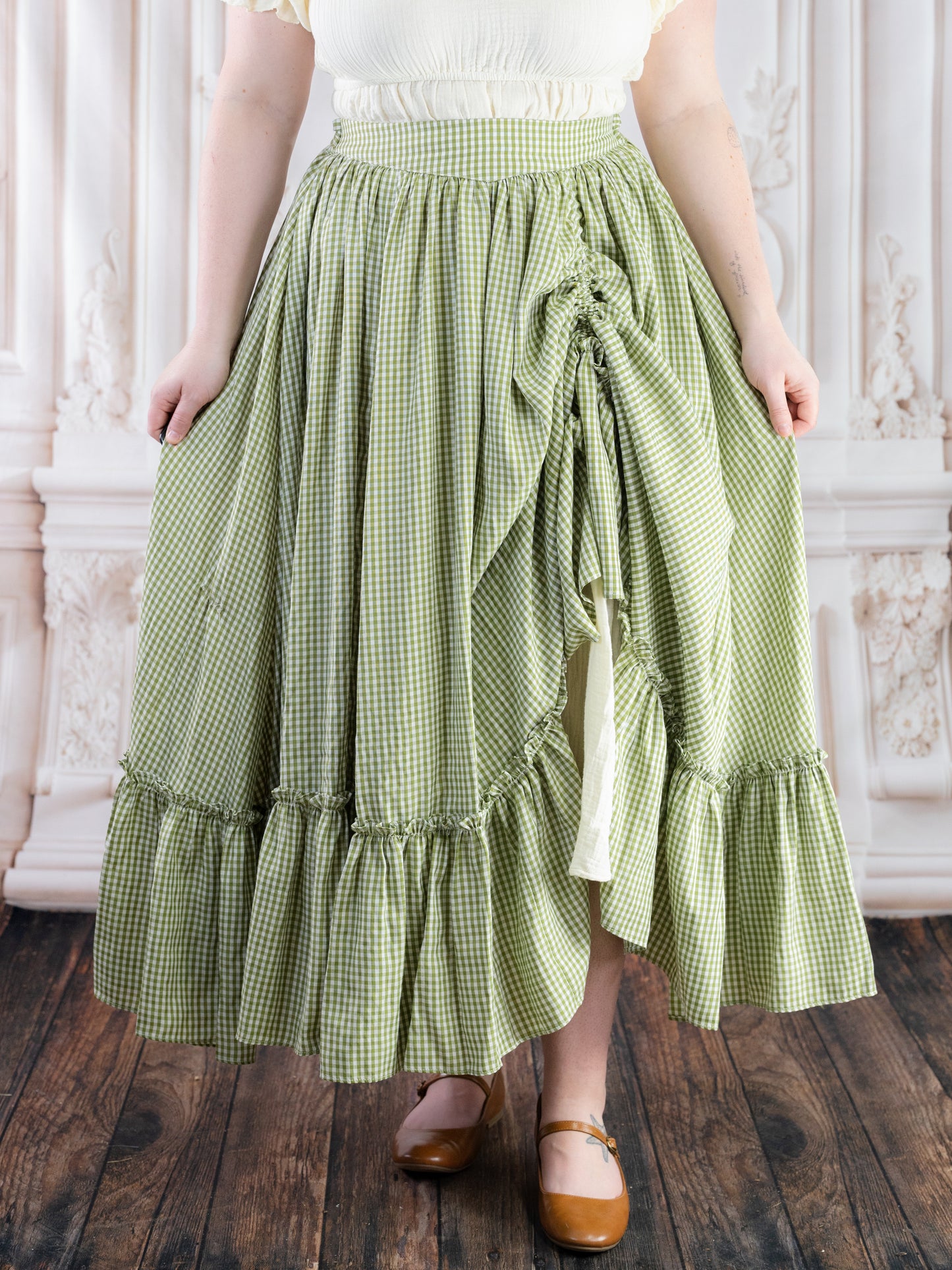 Green Gingham Ruffle Skirt with gathered waist and ruffled hem styled in a classic gingham pattern and soft fabric