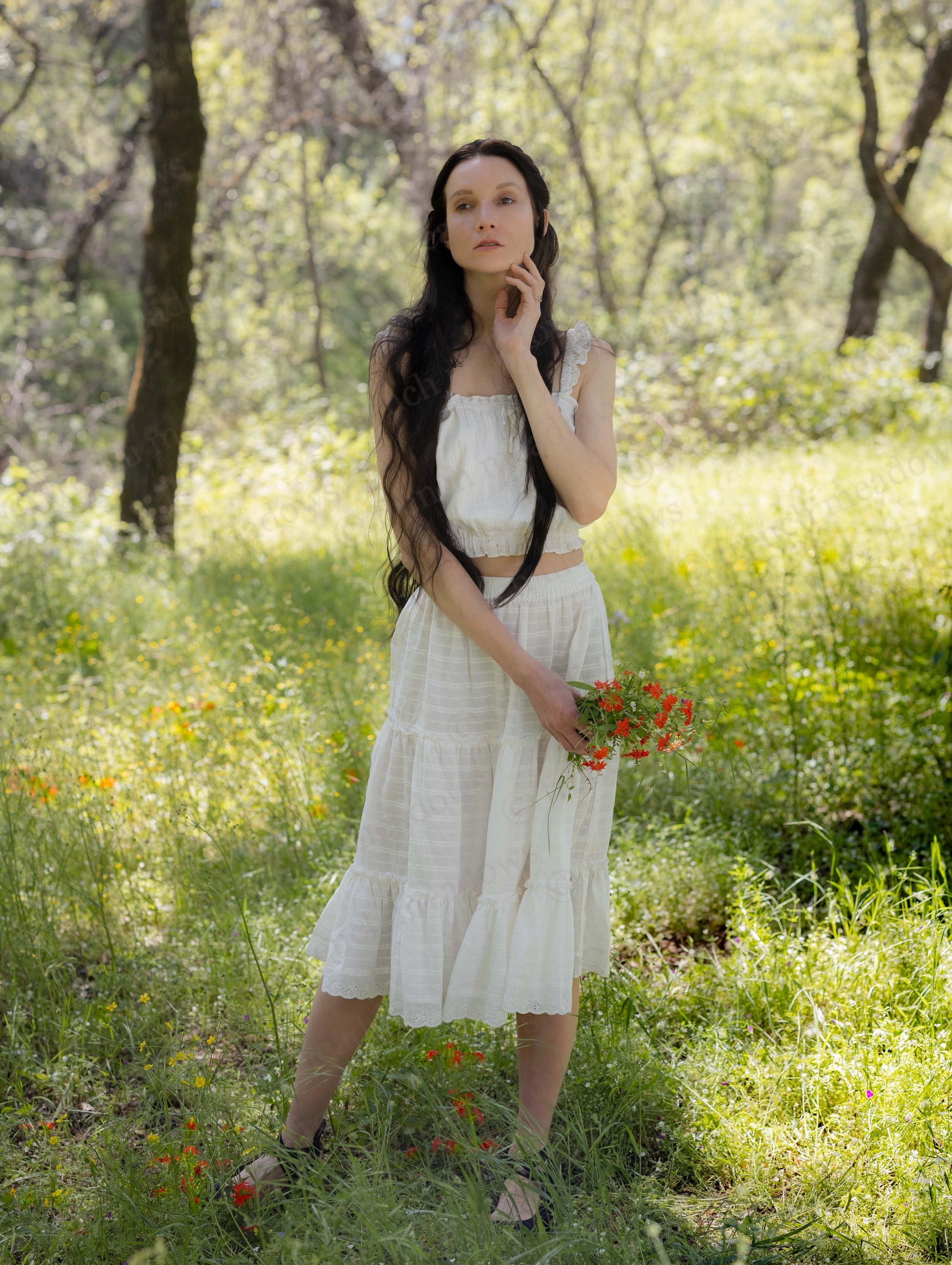 White Cotton Petticoat worn by woman outdoors, featuring three-tier ruffles and lace trim with elastic waistband.