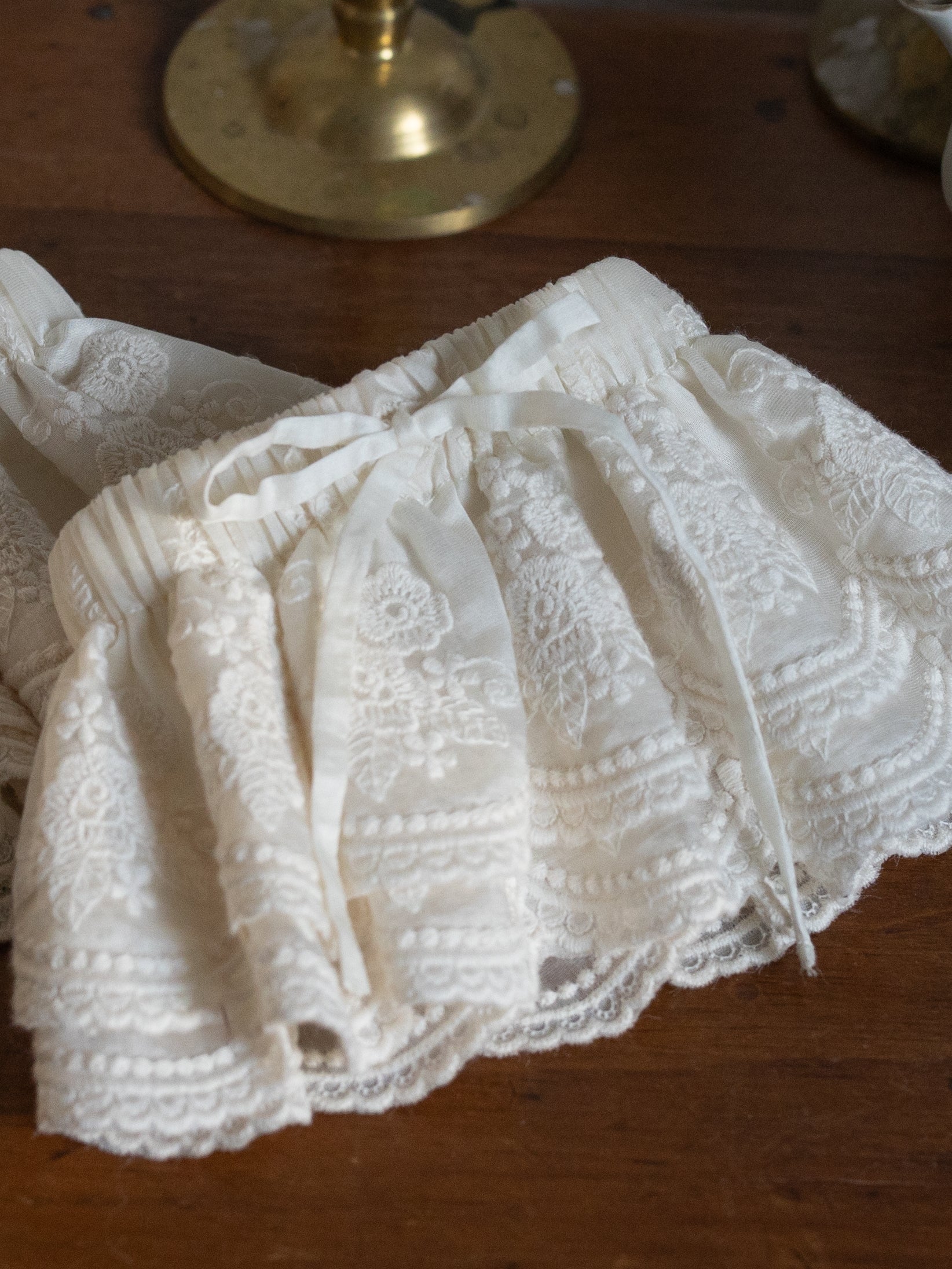 Lacey Ruffle Sleeves in delicate white lace with floral embroidery and a soft ribbon tie for a vintage inspired look