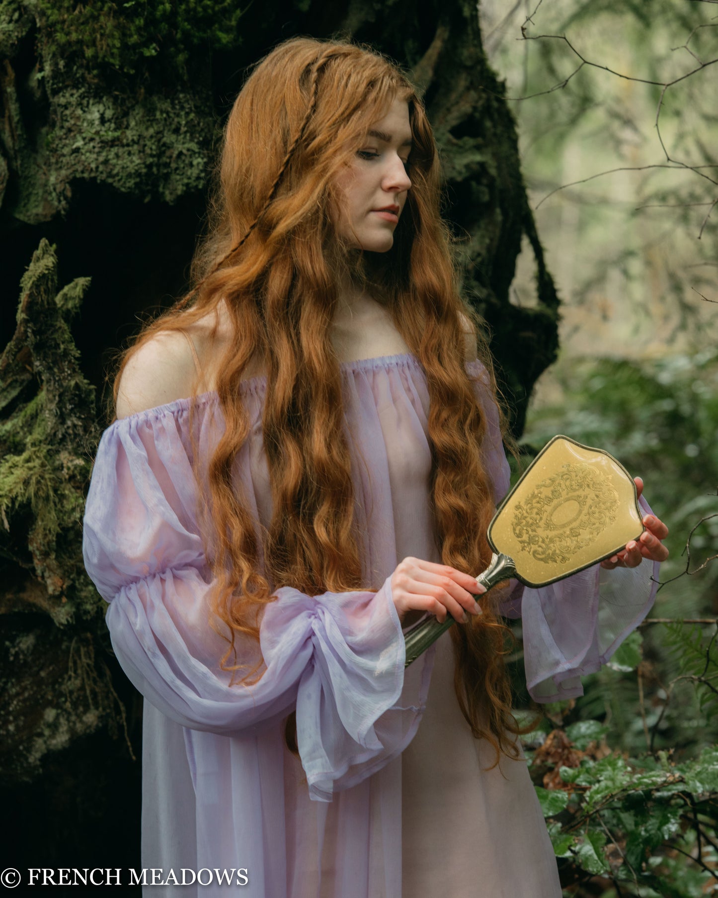 model wearing a sheer lilac dress for a fairy costume