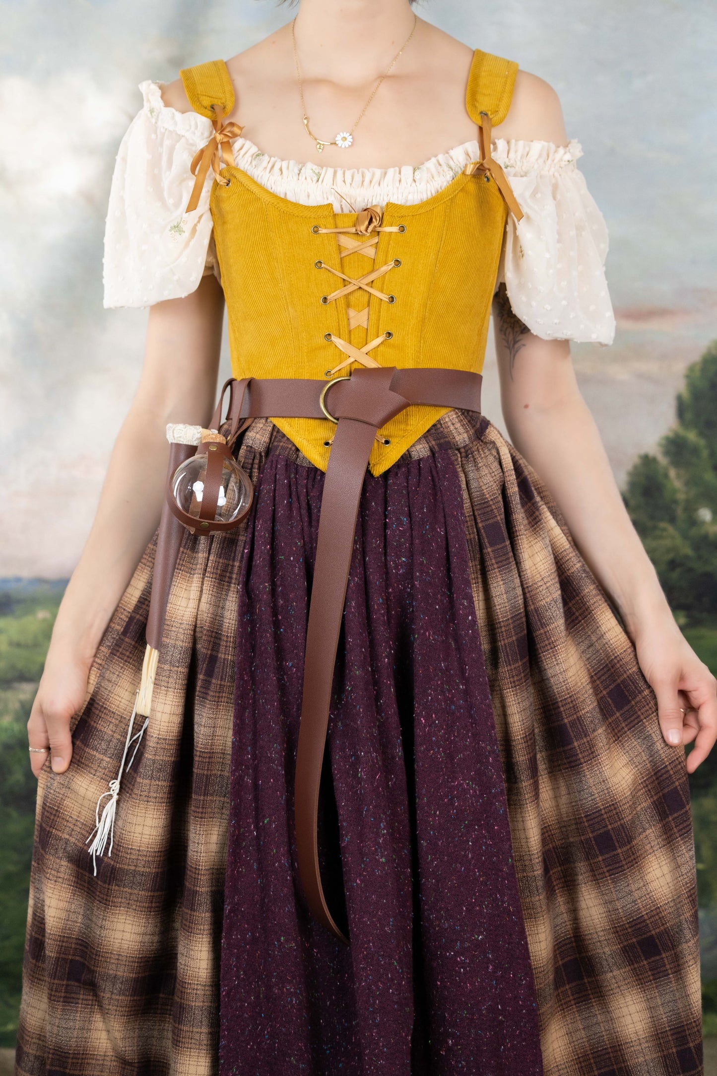 Handmade Mustard Corduroy Renaissance Corset worn over a white blouse with rustic skirt and leather belt accessories.