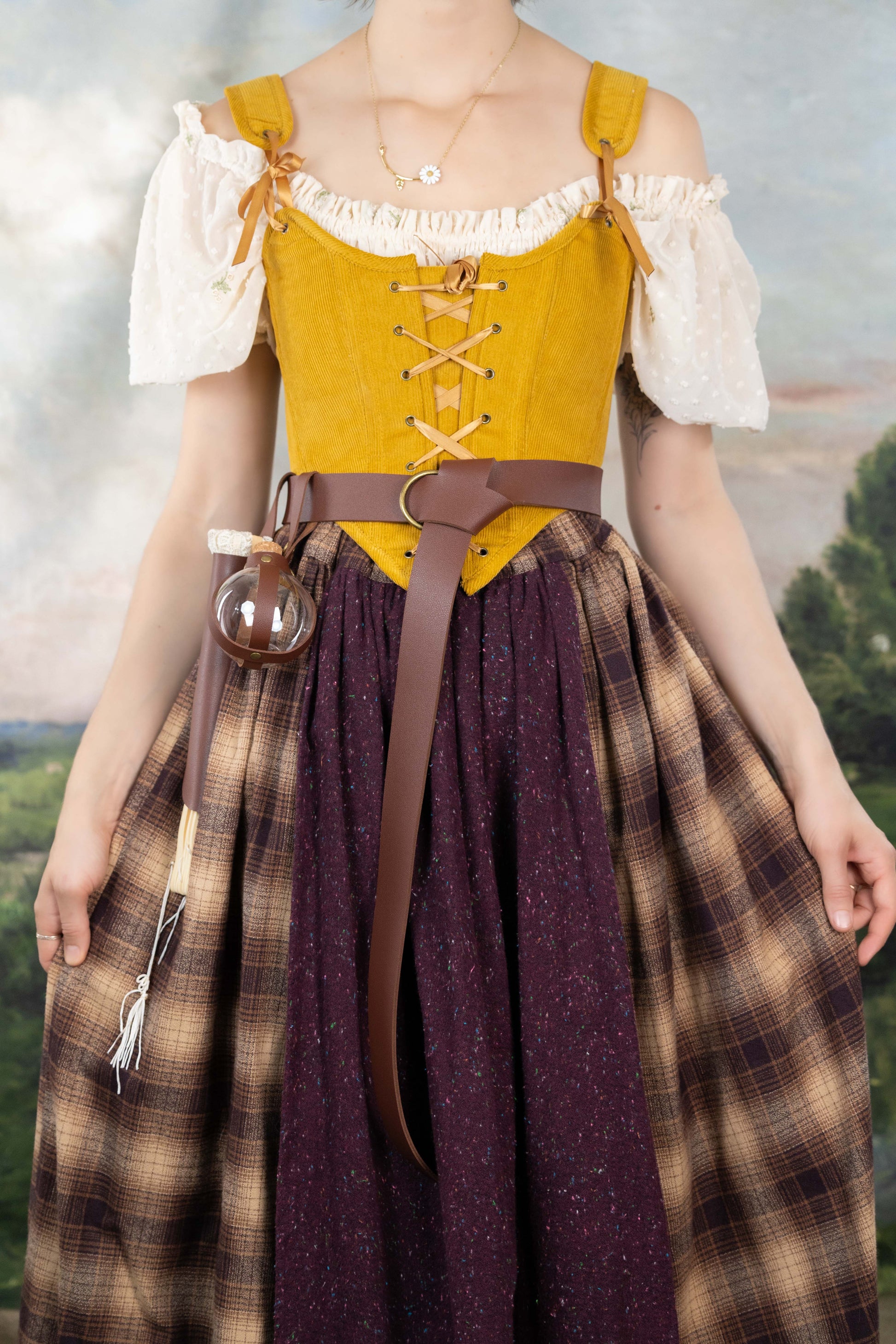 Handmade Mustard Corduroy Renaissance Corset worn over a white blouse with rustic skirt and leather belt accessories.
