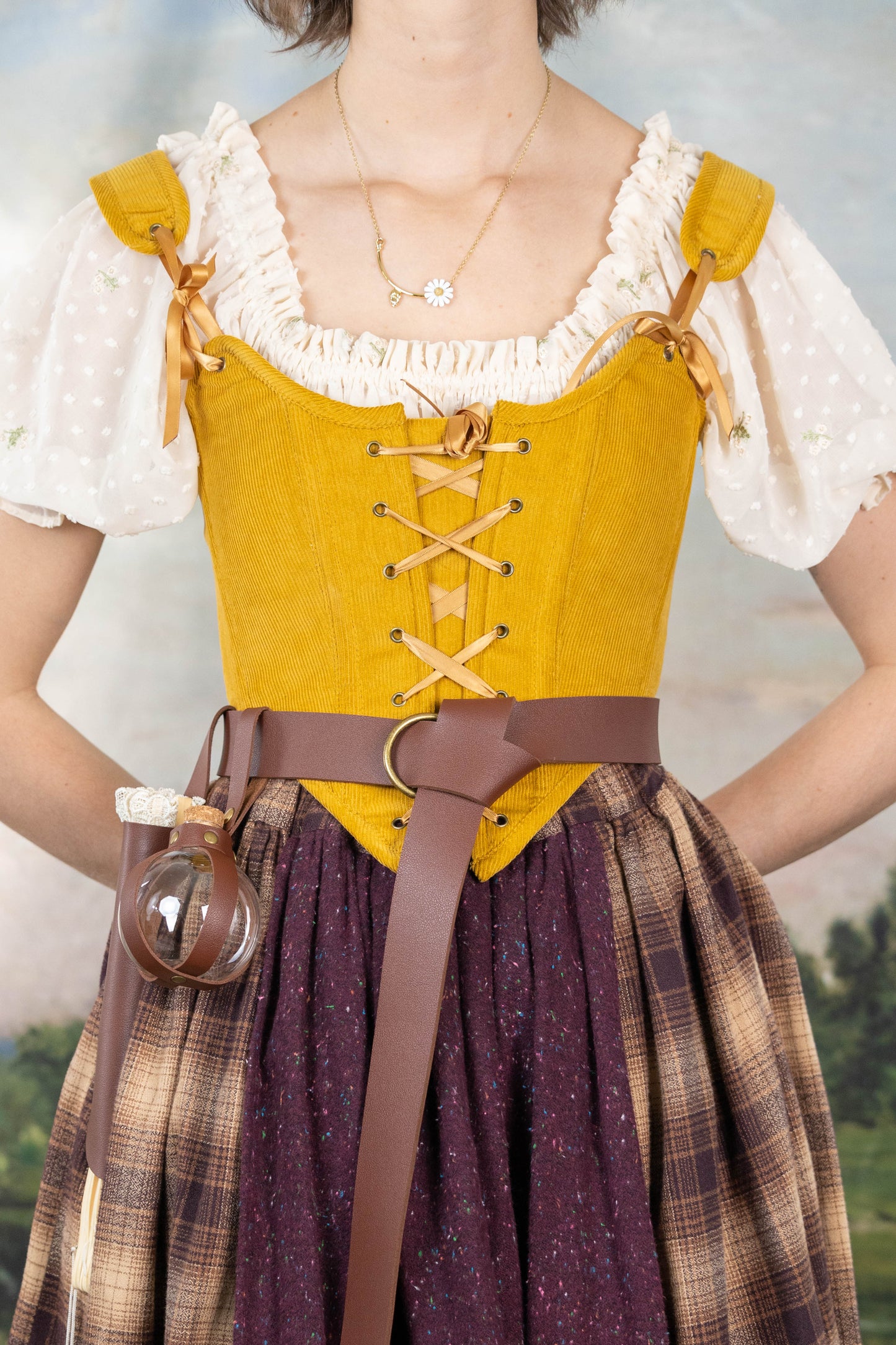 Handmade Mustard Corduroy Renaissance Corset worn over a white ruffled blouse with a brown belt and plaid skirt.