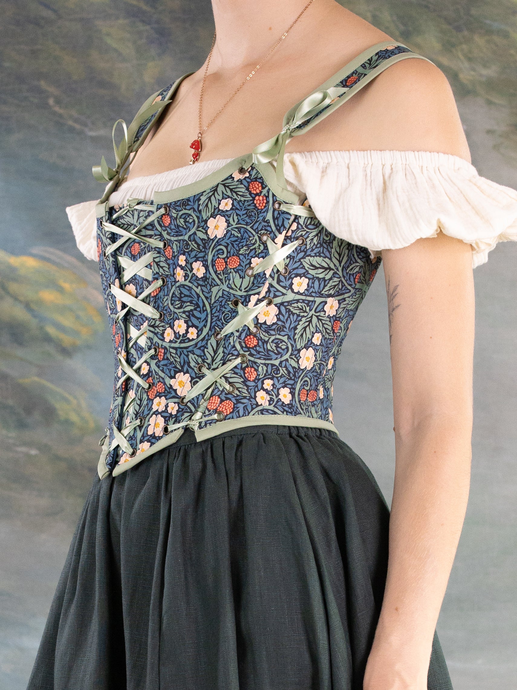 Raspberry Vines Princess Stays corset with floral pattern worn over white blouse and black skirt for elegant fit and comfort
