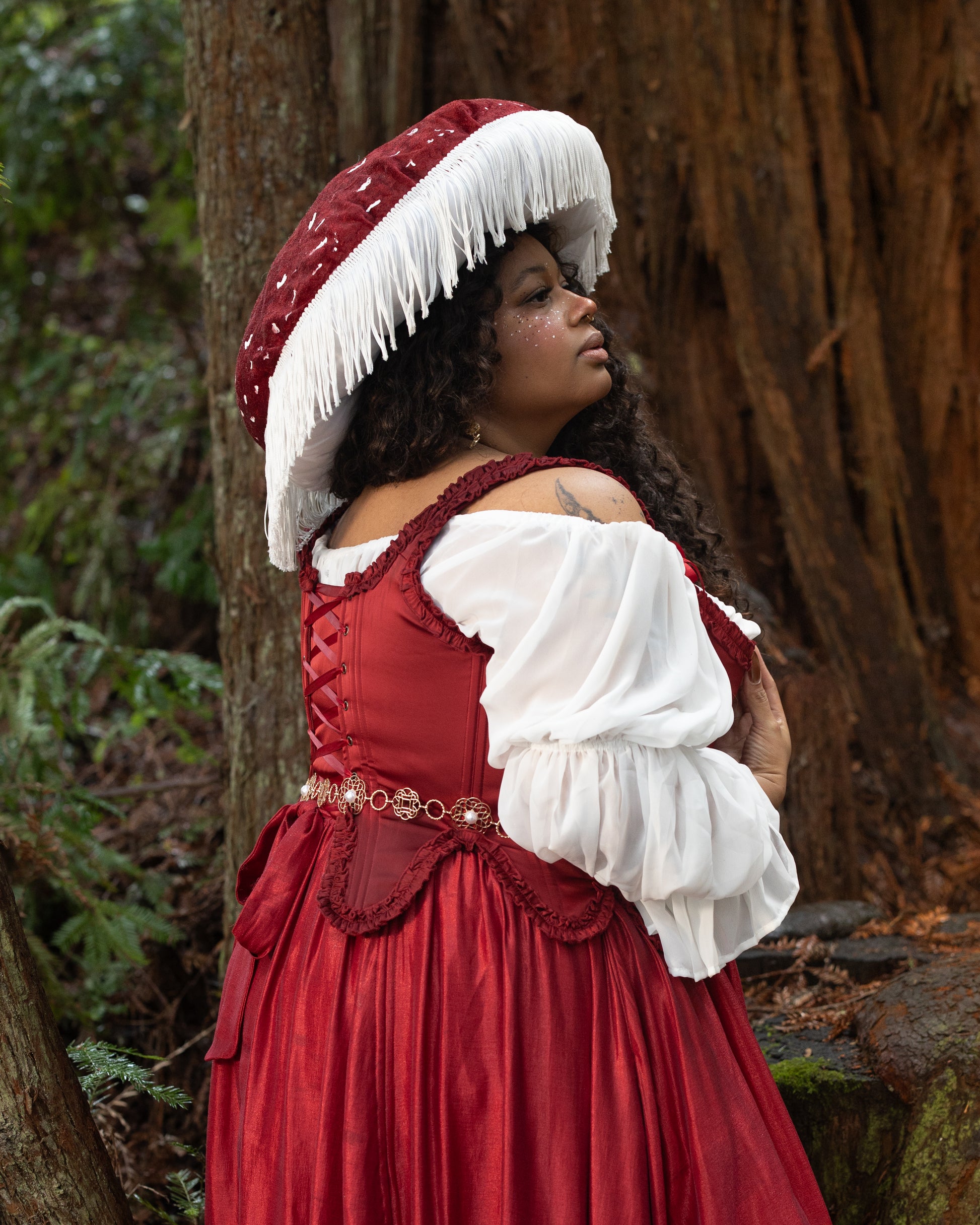 Red Satin 18th Century Stays in portrait, gallery position 5, showing back lacing and ruffle trim details outdoors