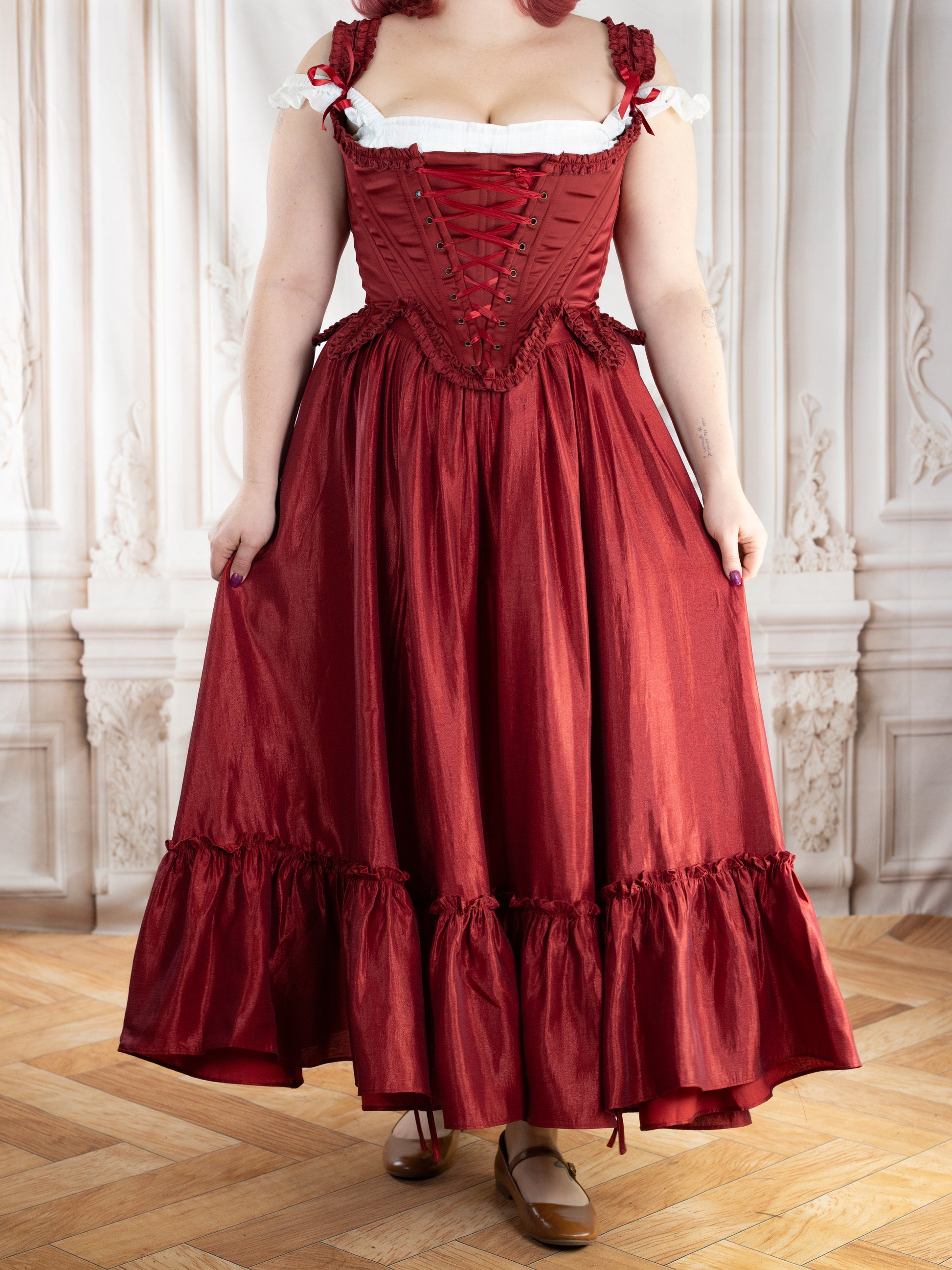 Red Satin 18th Century Stays with elegant ruffle trims and lace-up front creating a dramatic rococo silhouette