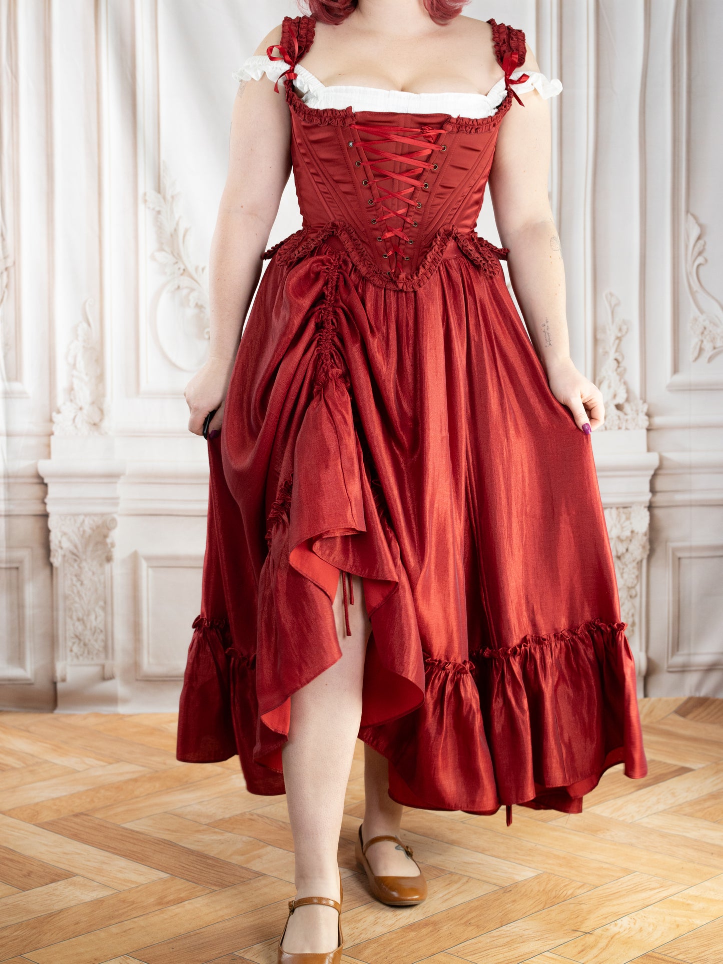 Woman wearing elegant dark red ruffle skirt with adjustable drawstrings styled in vintage setting Dark Red Ruffle Skirt