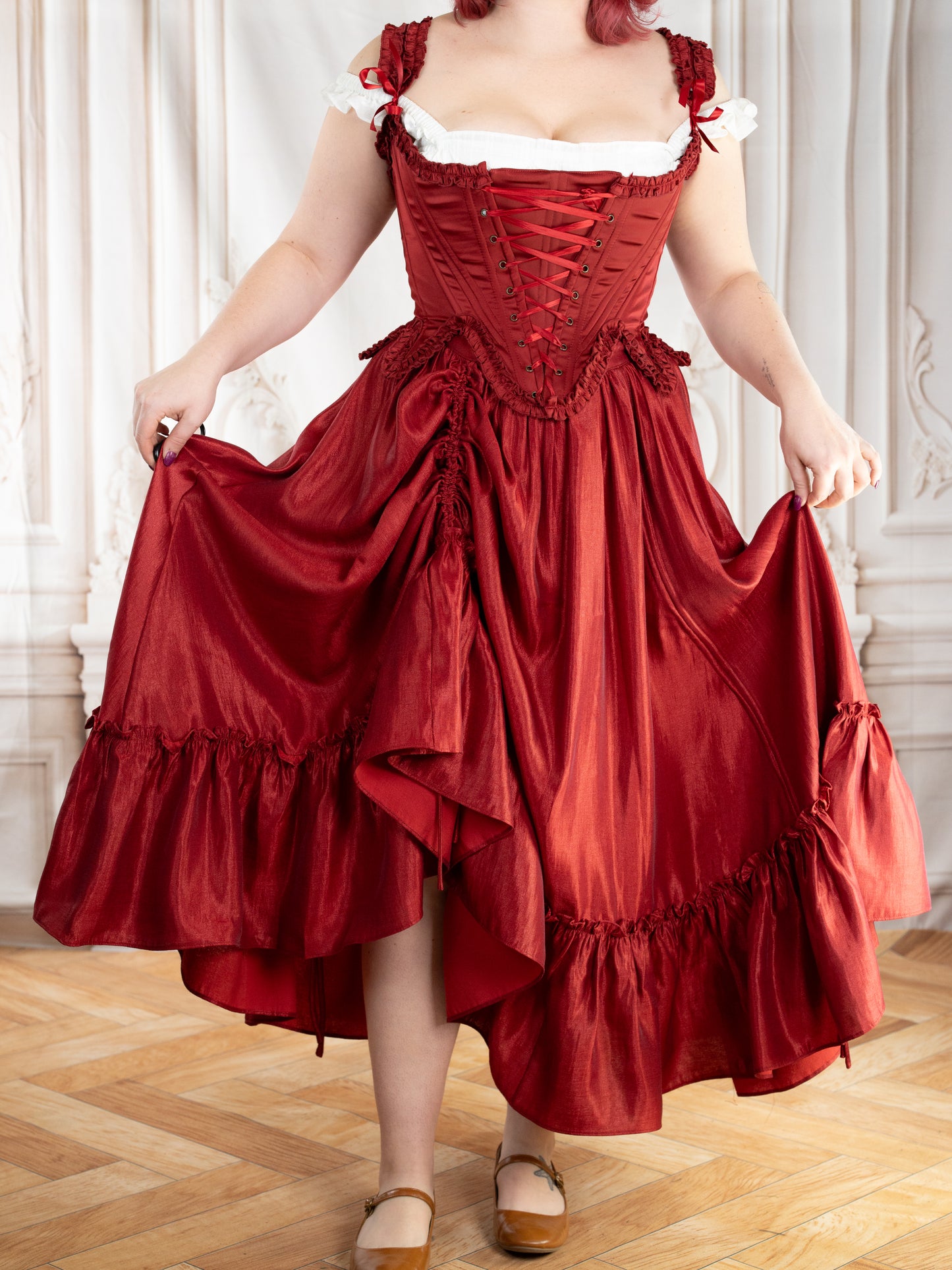 Dark Red Ruffle Skirt worn with a corset top, featuring adjustable drawstrings for a dramatic, gathered look.