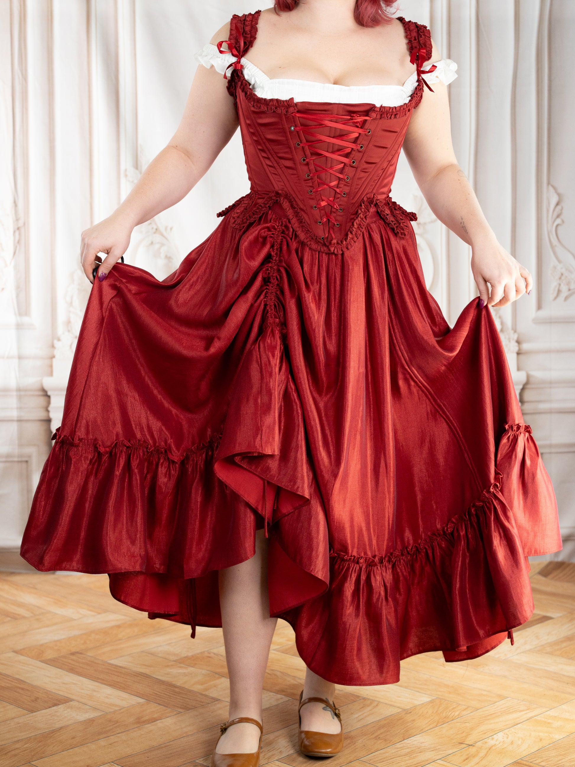 Dark Red Ruffle Skirt worn with a corset top, featuring adjustable drawstrings for a dramatic, gathered look.