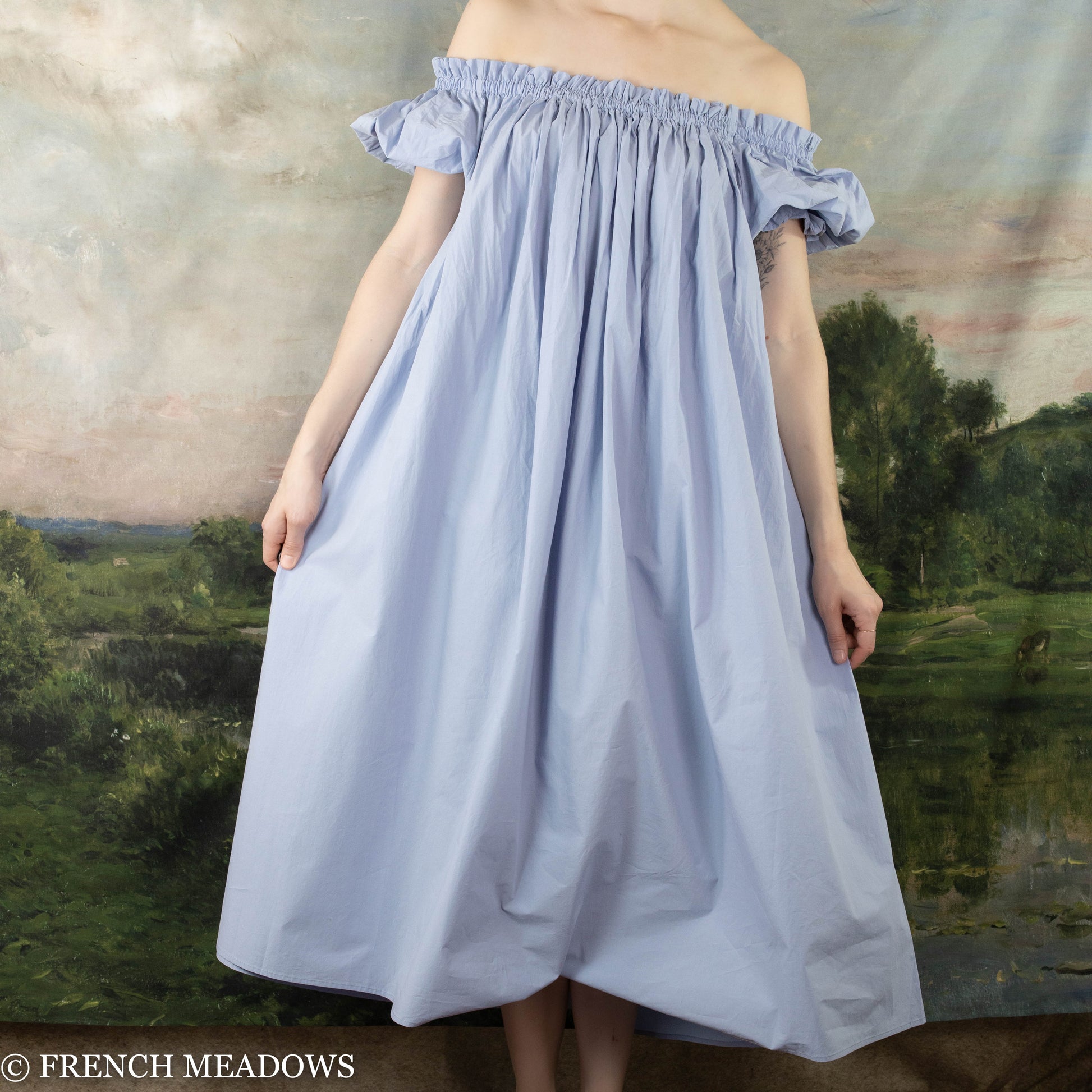 model wearing poofy cotton blue nightgown dress