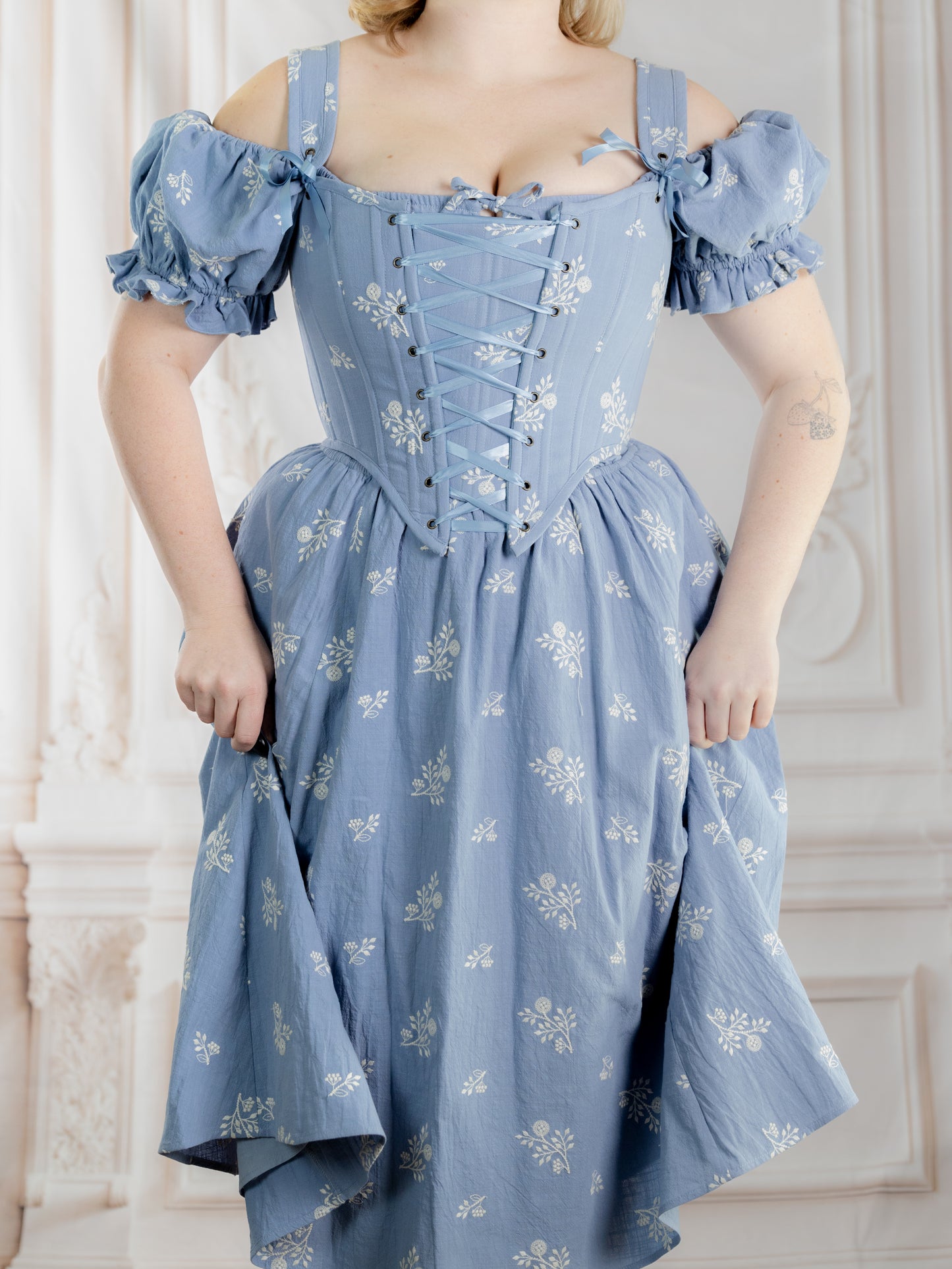 Regency Blue Floral Corset in light blue with white floral pattern and puffed sleeves worn with matching skirt