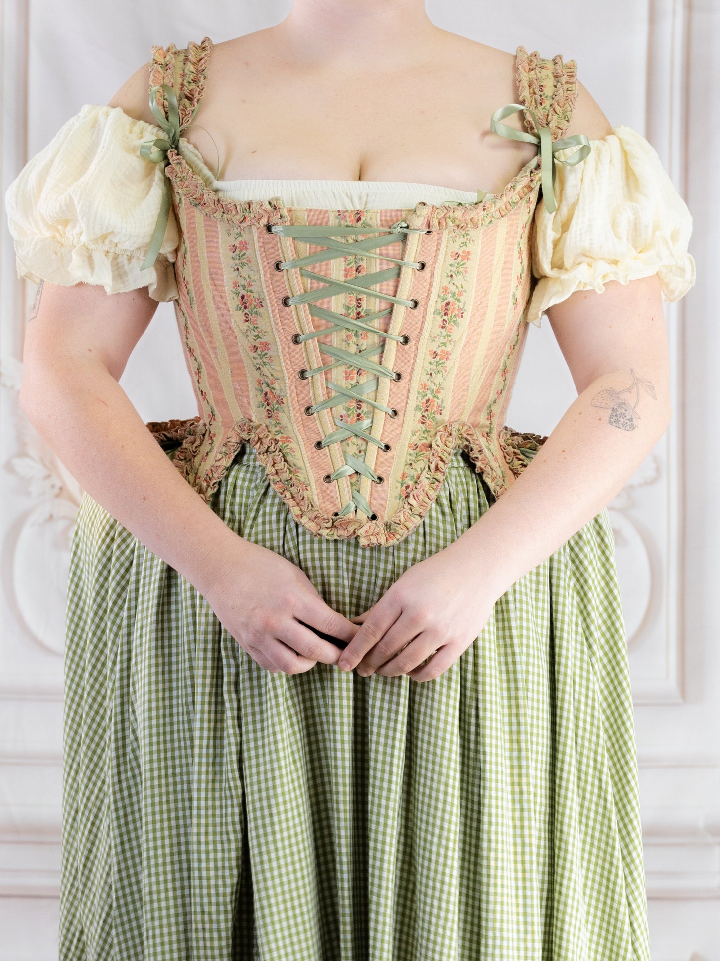 Rococo Pink 18th Century Stays with pastel stripes and laced front, styled with puffed sleeves and gingham skirt