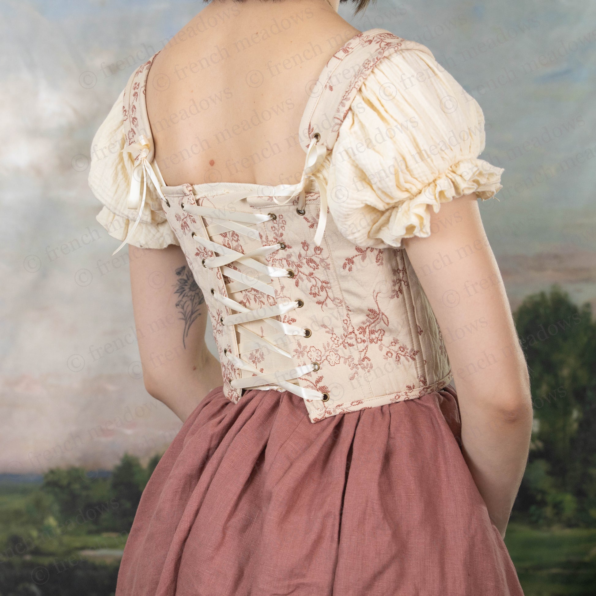 back view of rosey floral corset with front and back lacing and removable straps