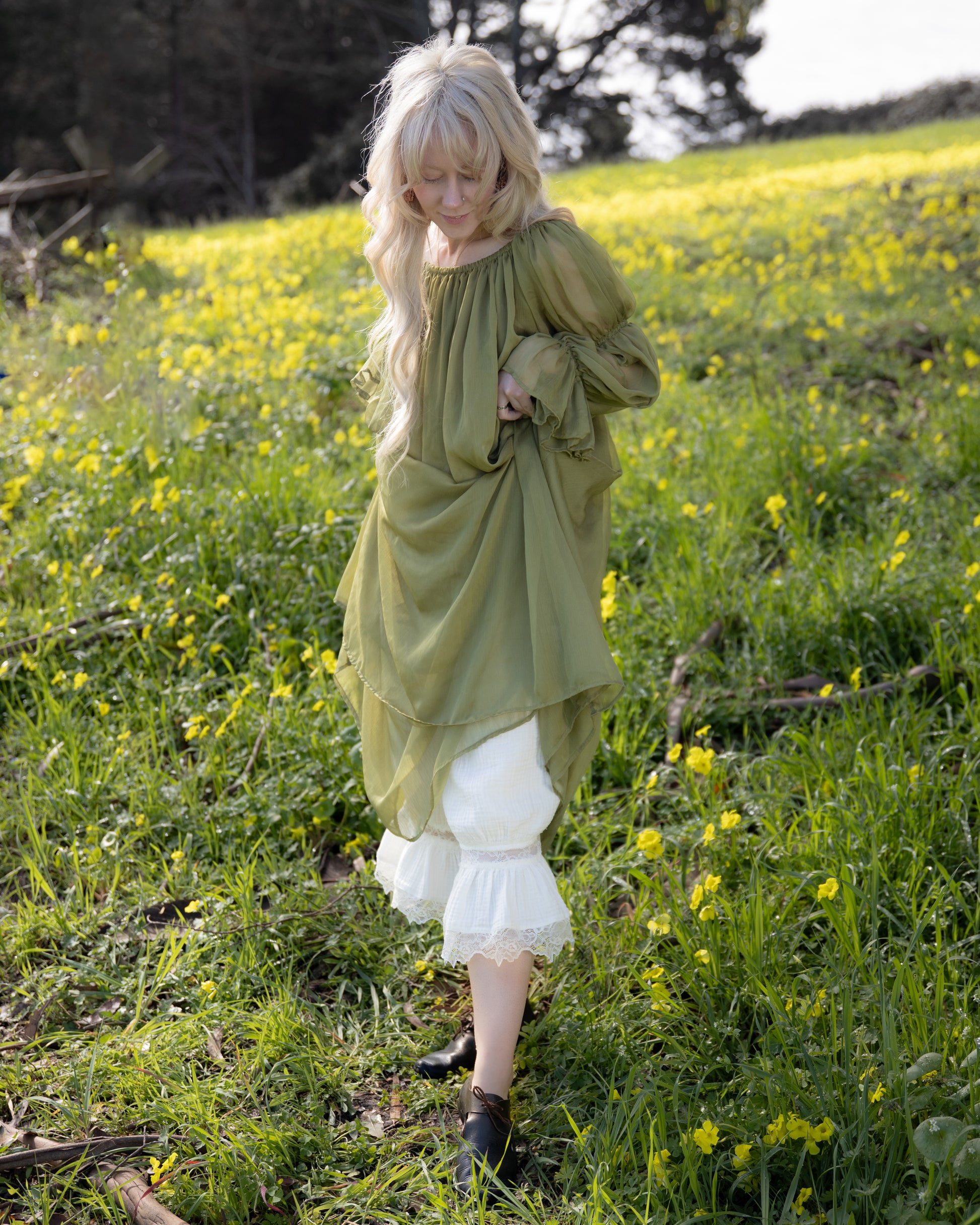 Woman in natural field wearing Sage Chiffon Chemise with flowing sleeves in soft natural light portrait 4000x5000