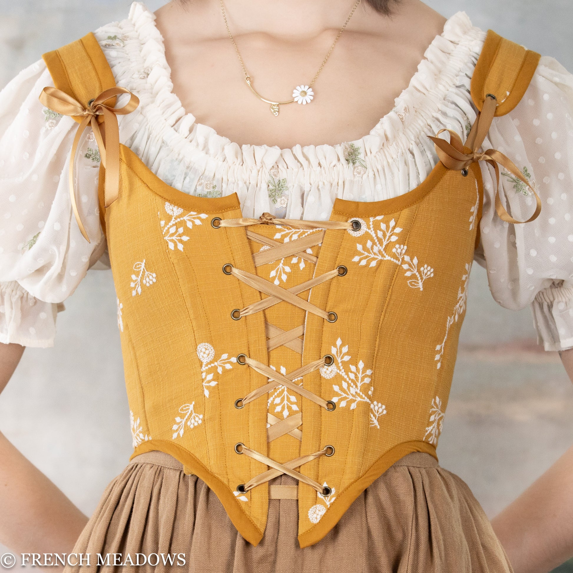 detail view of the yellow floral corset top