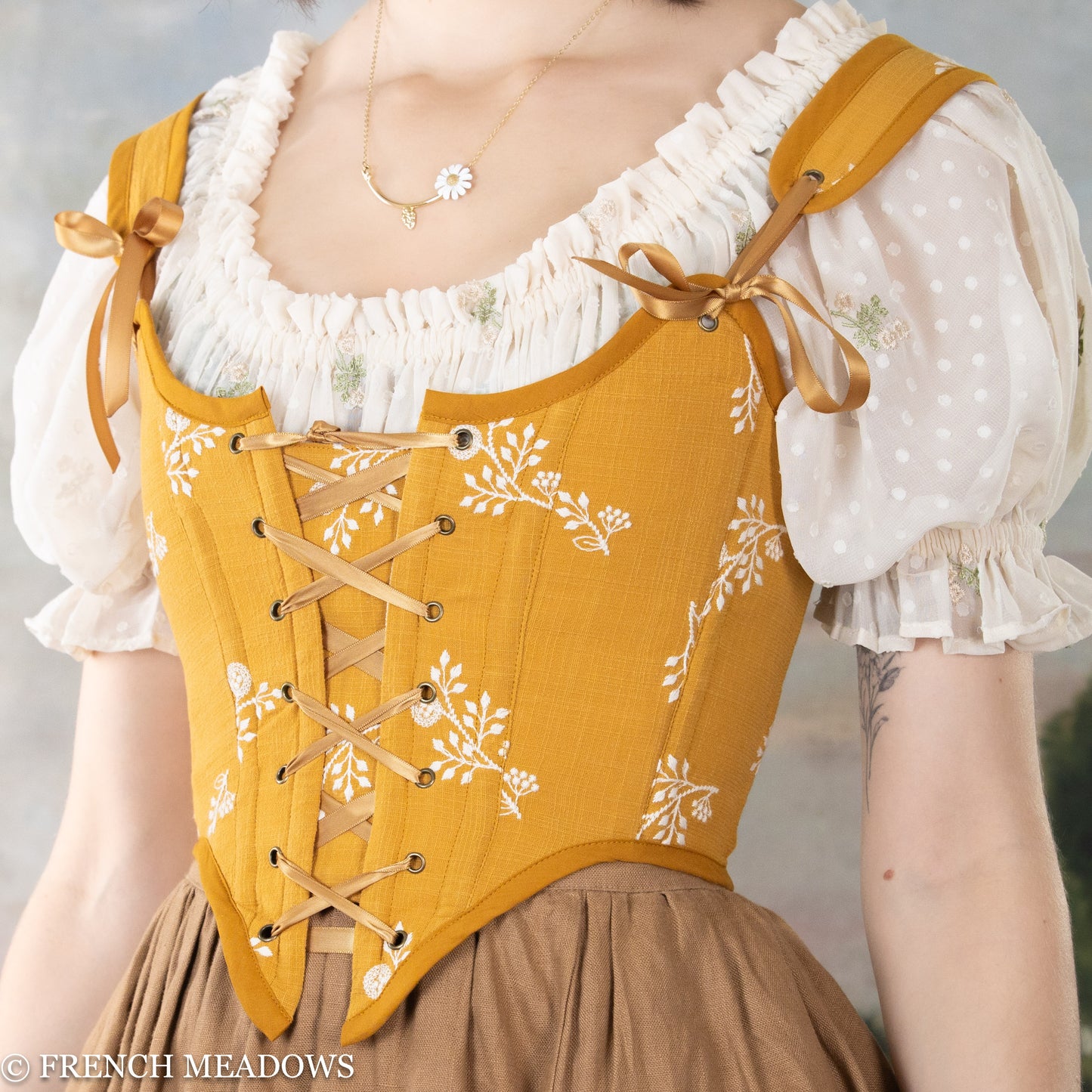 side detail view of the yellow floral renaissance bodice