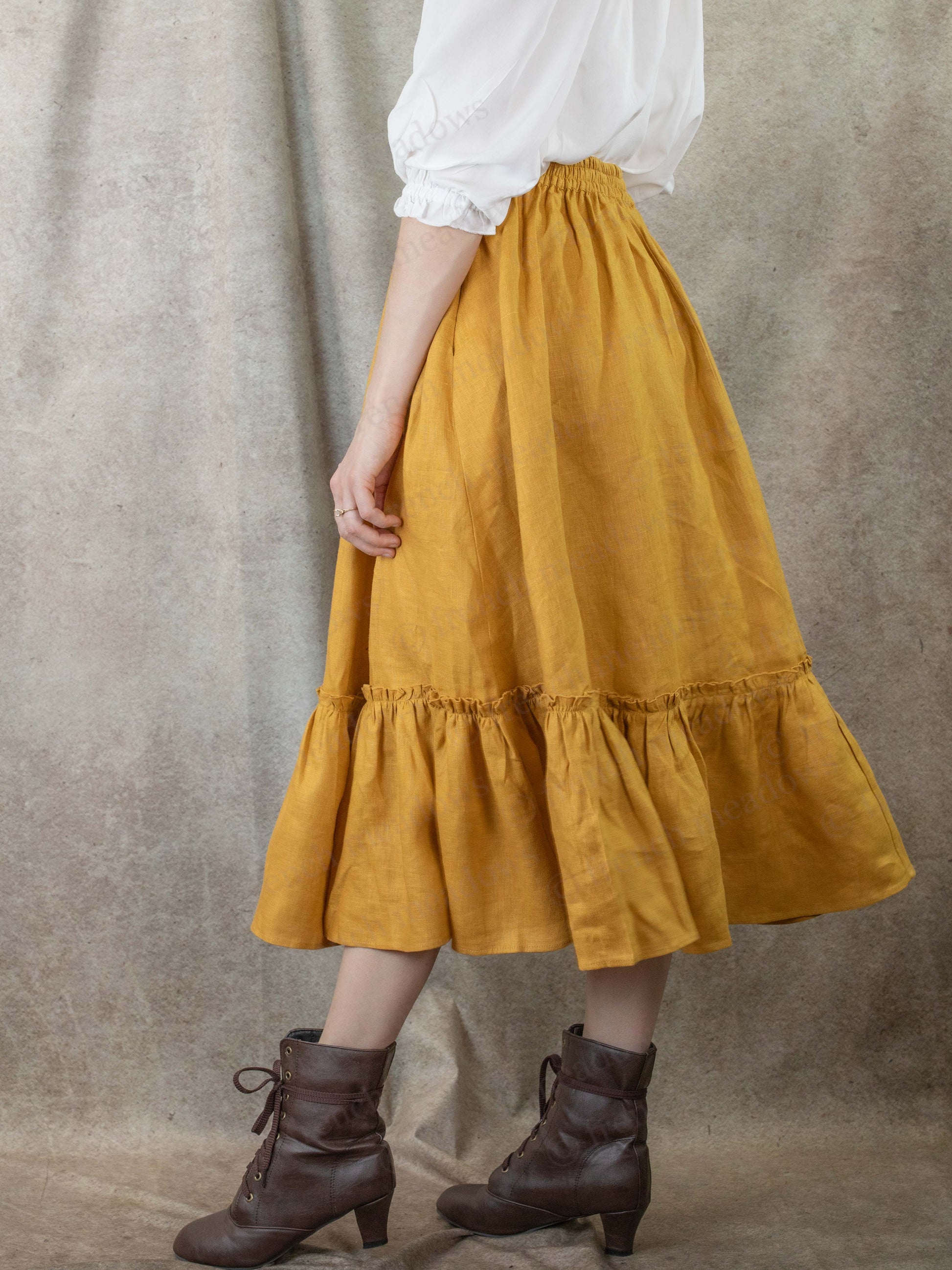 back view of model wearing yellow skirt with elastic waistband